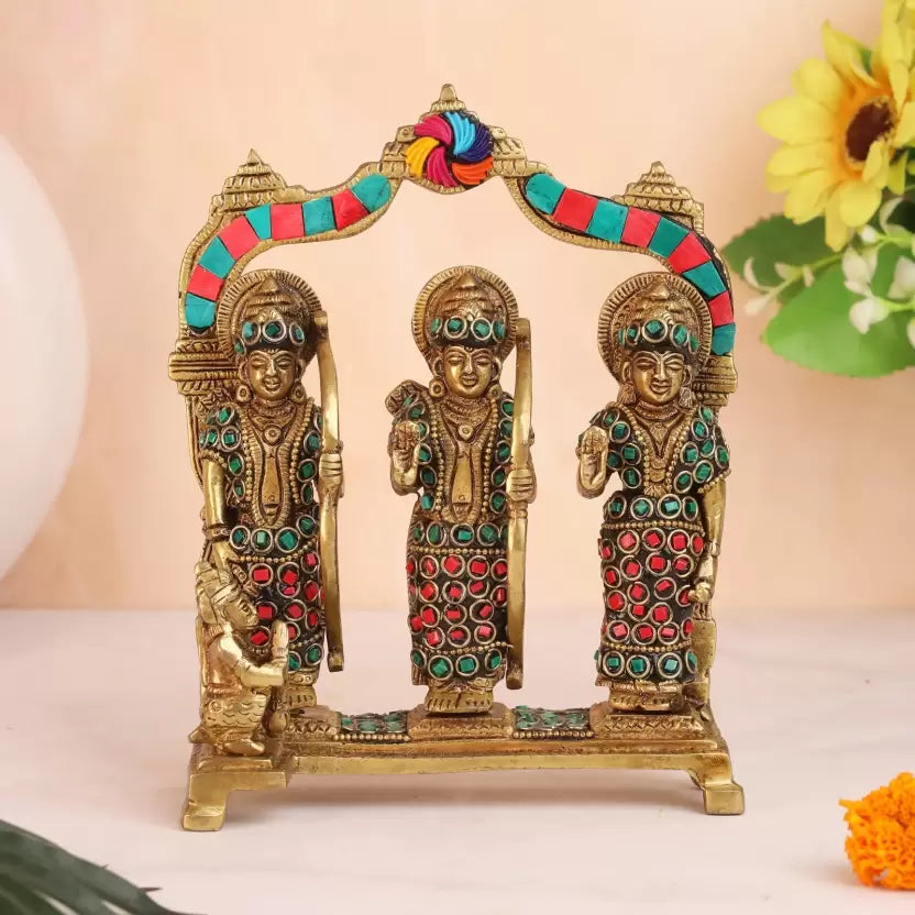 Brass Ram Darbar Idol with intricate detailing and colorful stones, perfect for home decor and religious practices. Available at www.hiretails.com.
