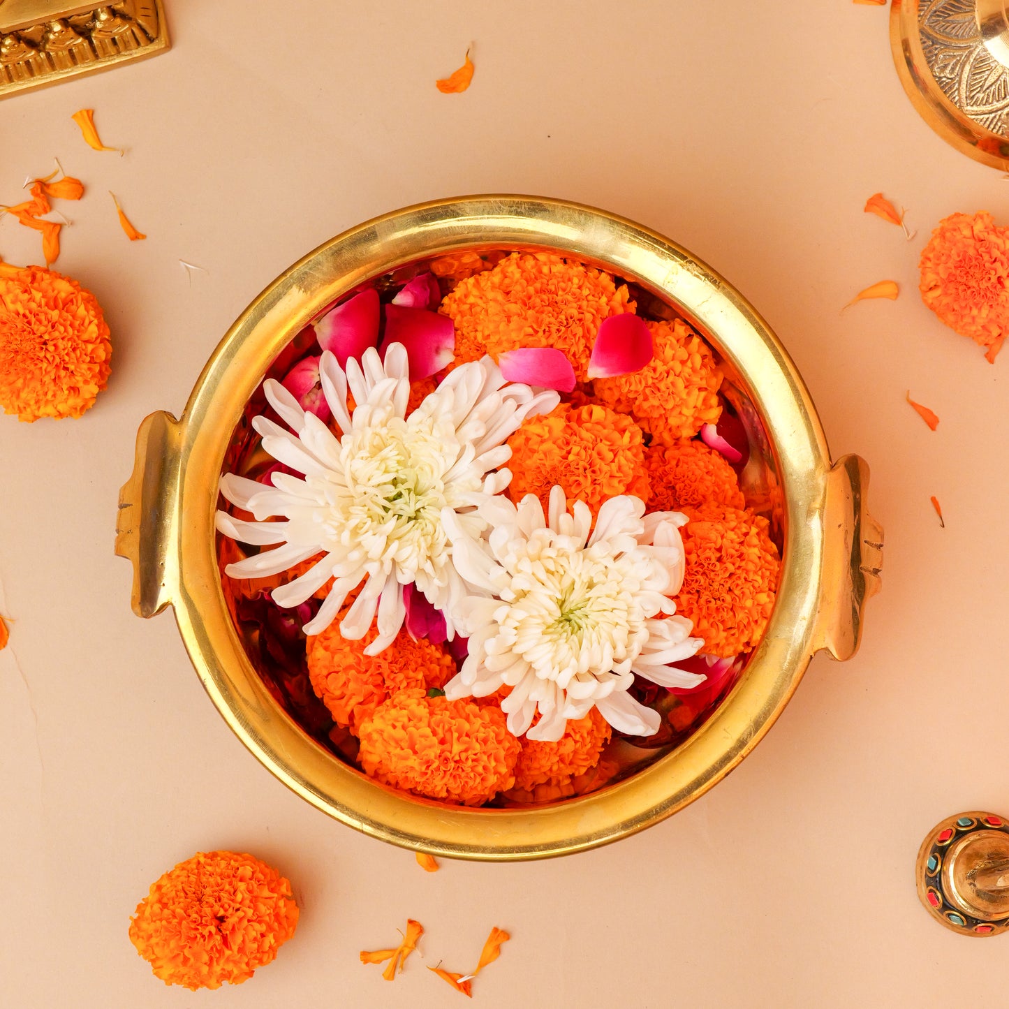 Brass Urli for Home Decor with Marigold and Flower Petals | Decorative Brass Urli for Pooja and Spiritual Use at www.hiretails.com