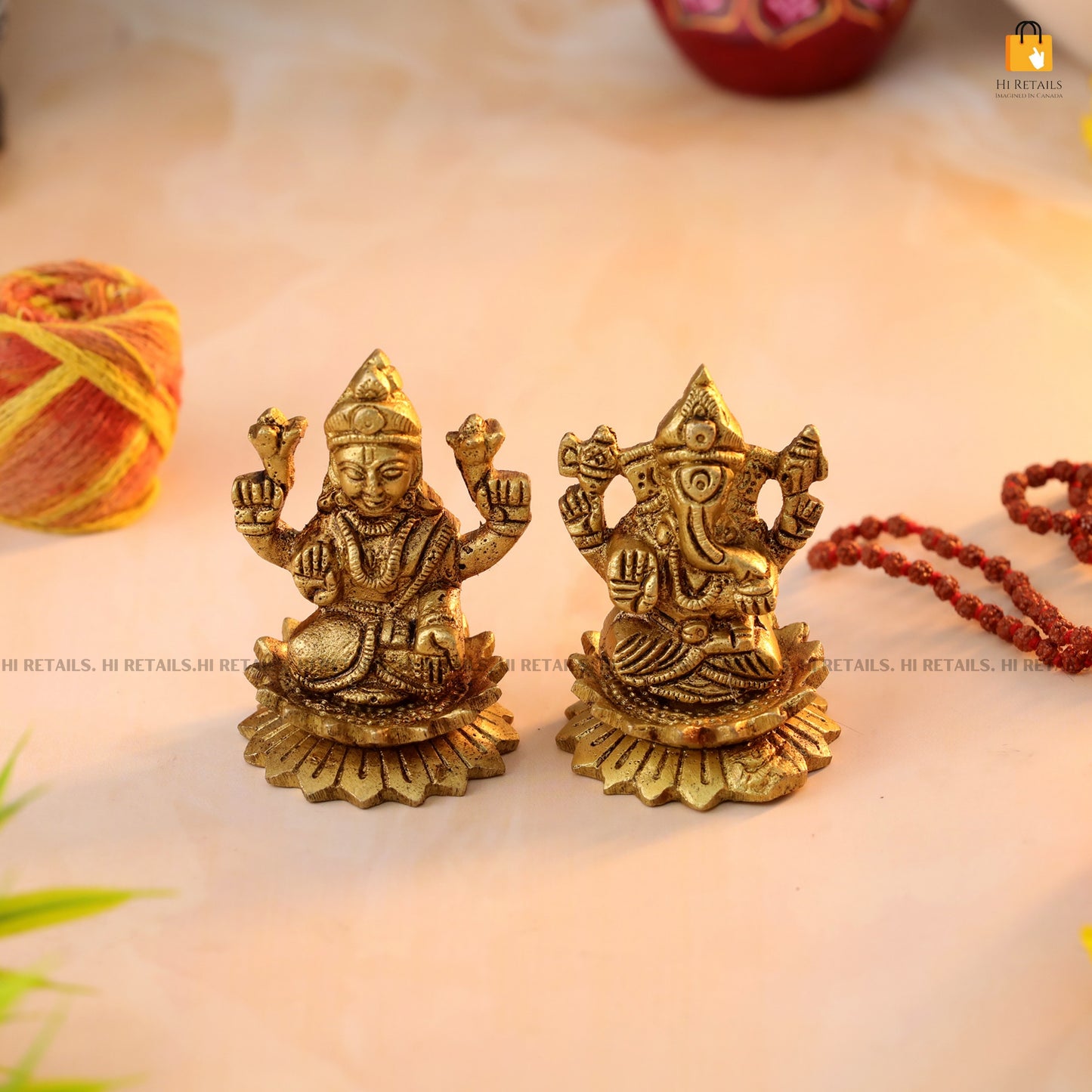 Exquisite brass Laxmi Ganesh Idol set on lotus, perfect for pooja rituals and home mandir decoration at www.hiretails.com