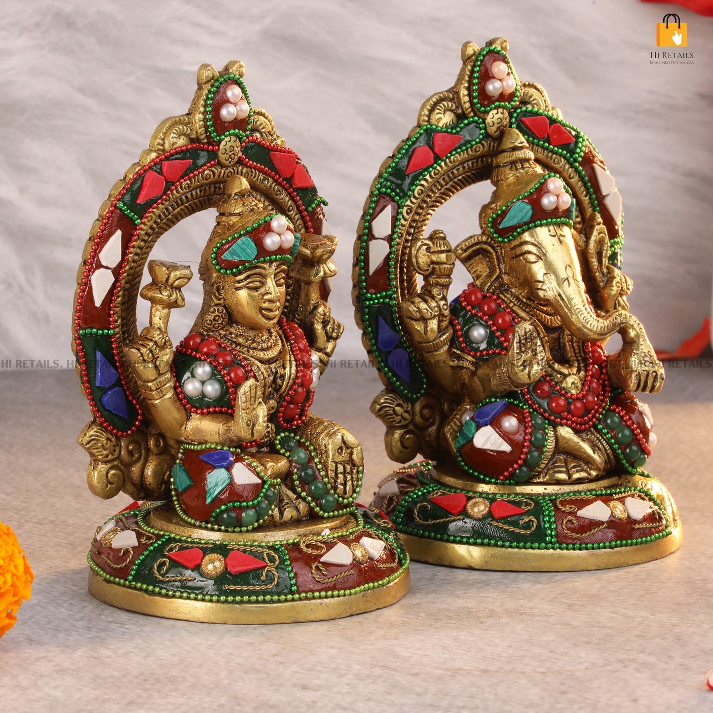 Brass Laxmi Ganesh idols with colorful stone work, an elegant decorative piece for home temple or spiritual decor at www.hiretails.com