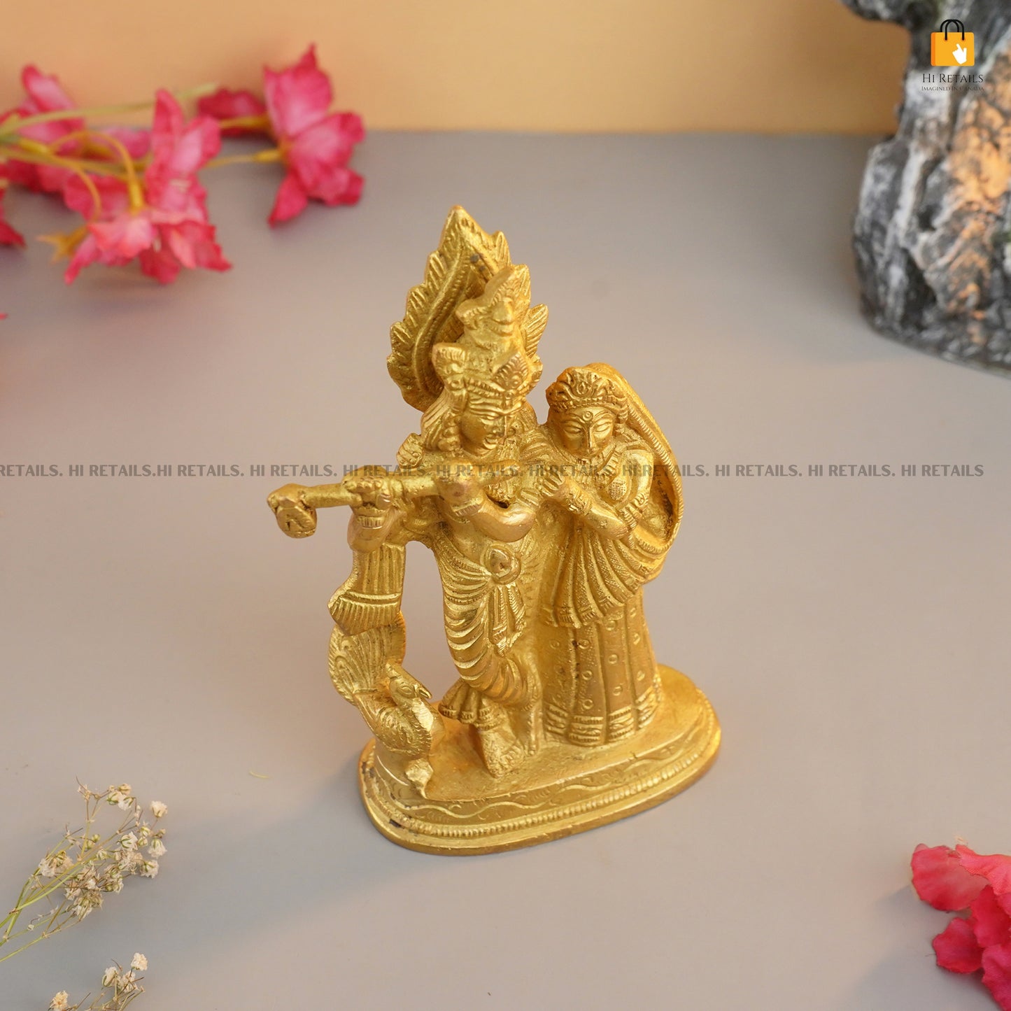 Brass Krishna and Radha idol with fine detailing, ideal for display as a decorative showpiece or for spiritual purposes. Available at www.hiretails.com.