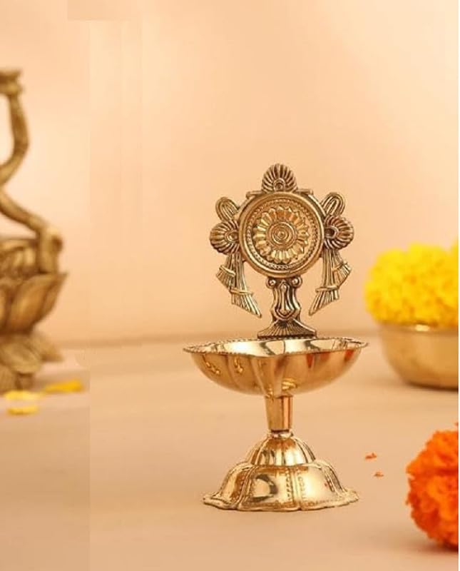 Pure Brass Chakra Kuber Diya for Diwali and Puja decor, offering an elegant touch to your spiritual rituals. Available at www.hiretails.com.