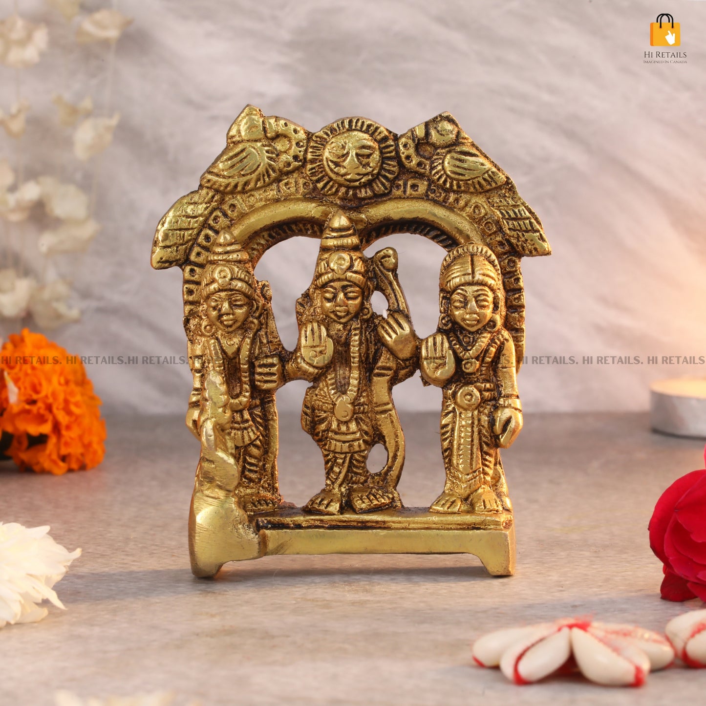 Brass Lord Ram, Sita, and Lakshman idol with detailed arch, ideal for religious rituals and home decor. Available at www.hiretails.com.