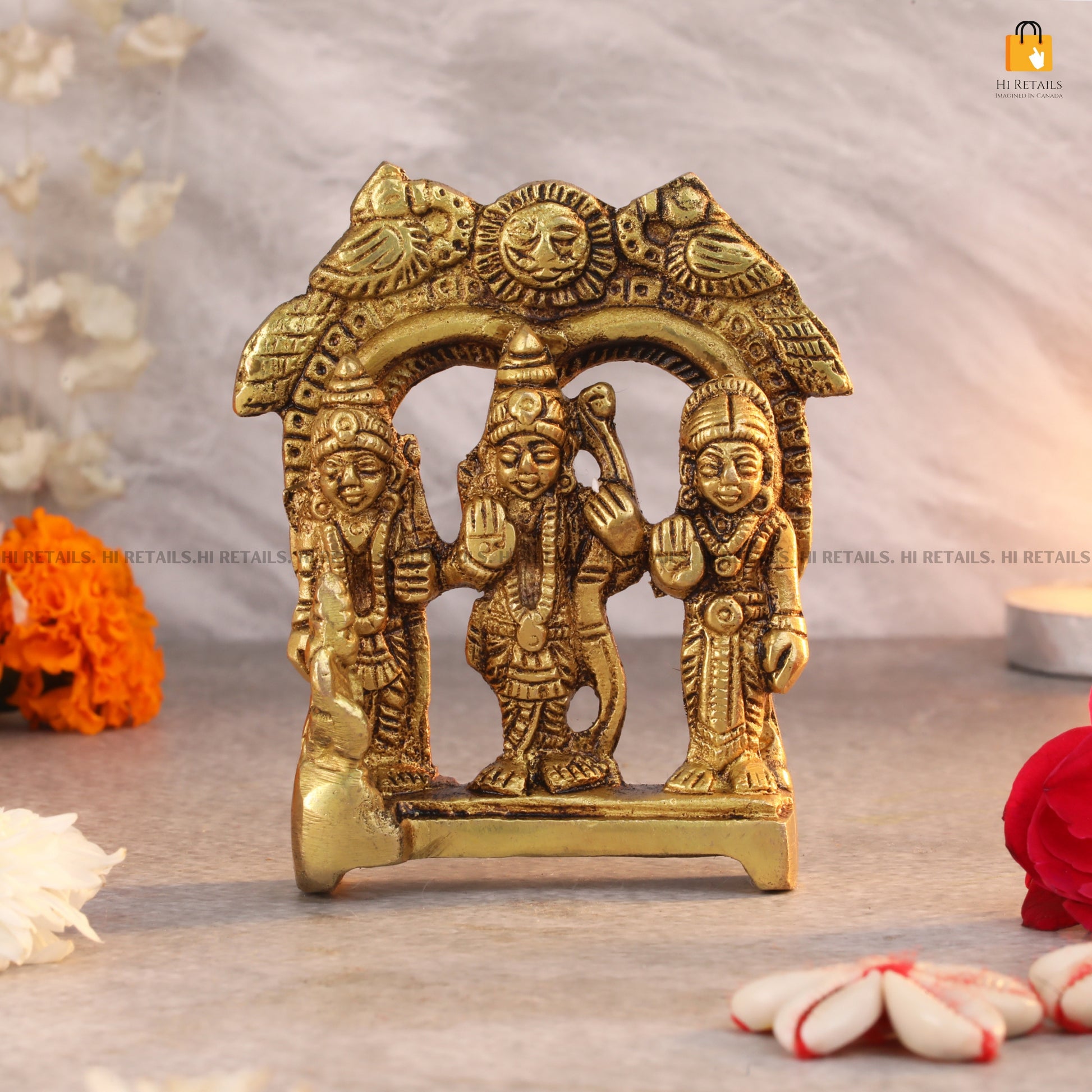 Brass Lord Ram, Sita, and Lakshman idol with detailed arch, ideal for religious rituals and home decor. Available at www.hiretails.com.