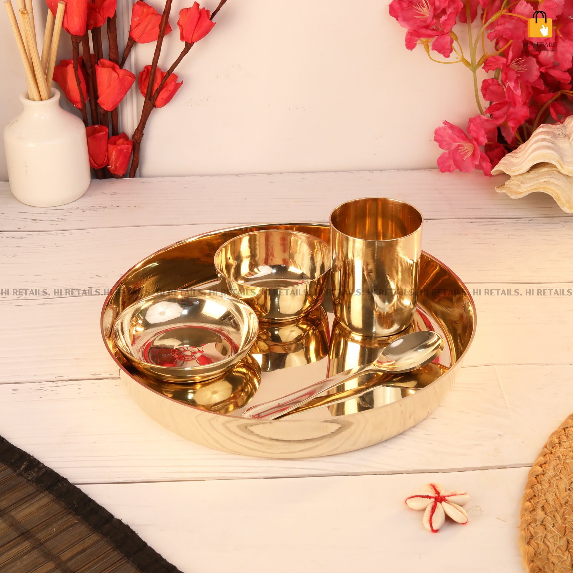 Beautiful kansa thali dinner set with traditional serving bowls and spoon for elegant dining at www.hiretails.com